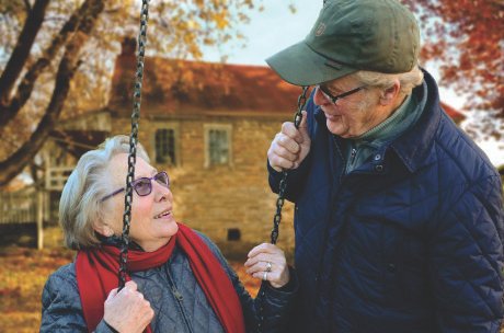 Elderly couple enjoying a fall day.