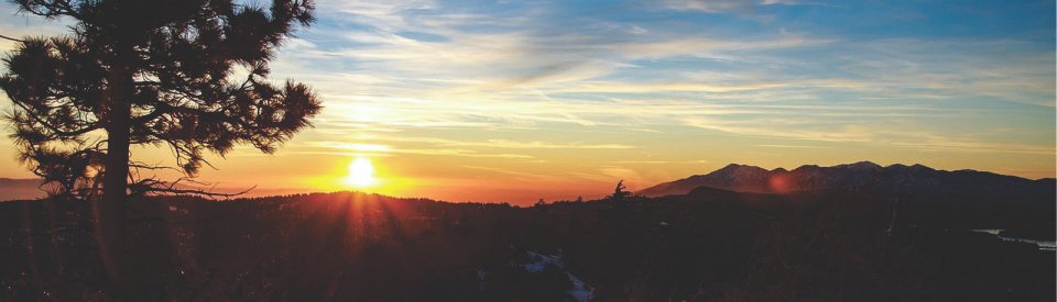 Sunset over a mountainous landscape.