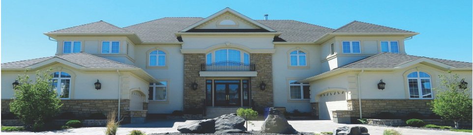 A large, elegant suburban house with a symmetrical facade.